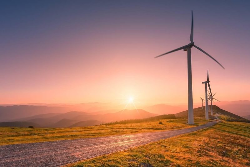 wind turbines at sunset